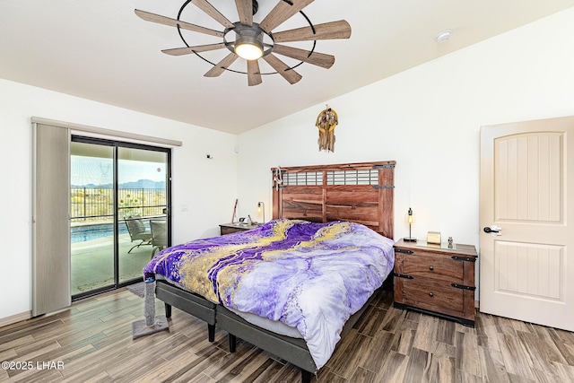bedroom with wood finished floors, ceiling fan, lofted ceiling, and access to outside