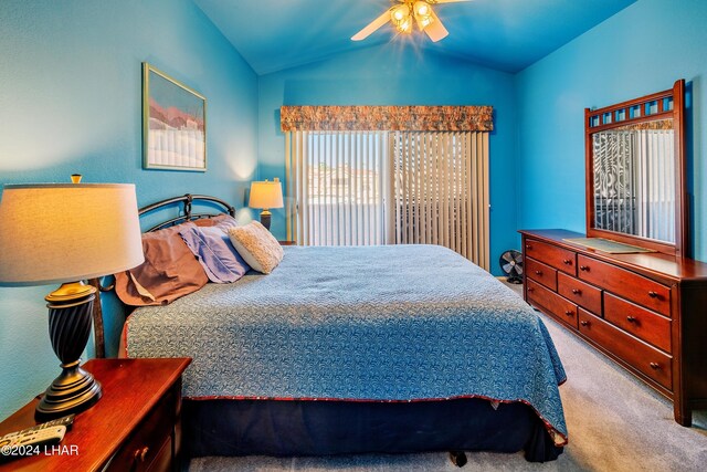 carpeted bedroom with ceiling fan and lofted ceiling