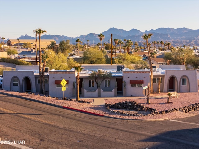 view of front of property with a mountain view