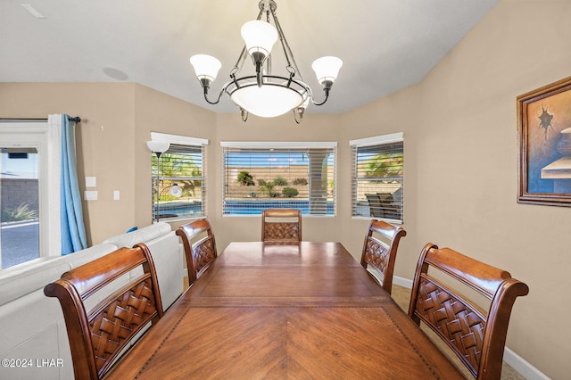 dining area featuring an inviting chandelier