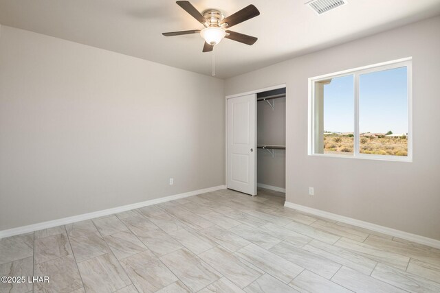 9342 N Broken Saddle Dr, Kingman, AZ 86401 - unfurnished bedroom with a closet and a ceiling fan