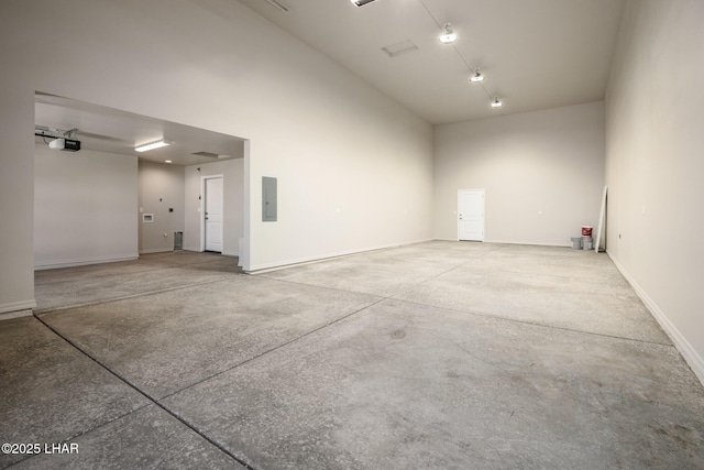 9342 N Broken Saddle Dr, Kingman, AZ 86401 - garage featuring a garage door opener and electric panel