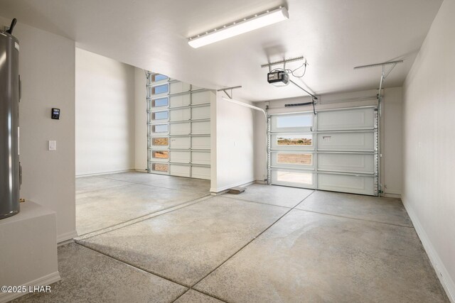 9342 N Broken Saddle Dr, Kingman, AZ 86401 - garage with a garage door opener and baseboards