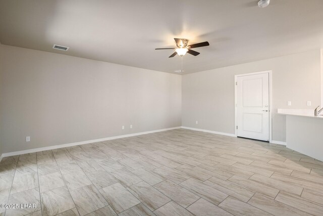 9342 N Broken Saddle Dr, Kingman, AZ 86401 - empty room featuring ceiling fan and baseboards