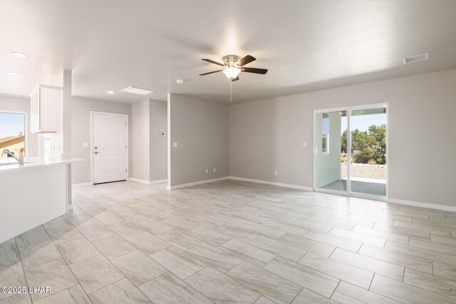 9342 N Broken Saddle Dr, Kingman, AZ 86401 - spare room with a ceiling fan and recessed lighting