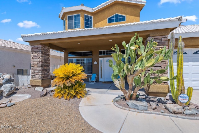 doorway to property featuring stucco siding