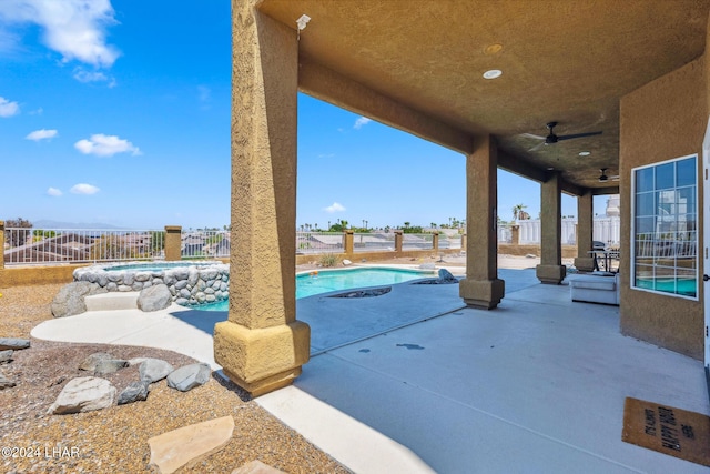 view of patio / terrace with a fenced backyard, a ceiling fan, and a fenced in pool