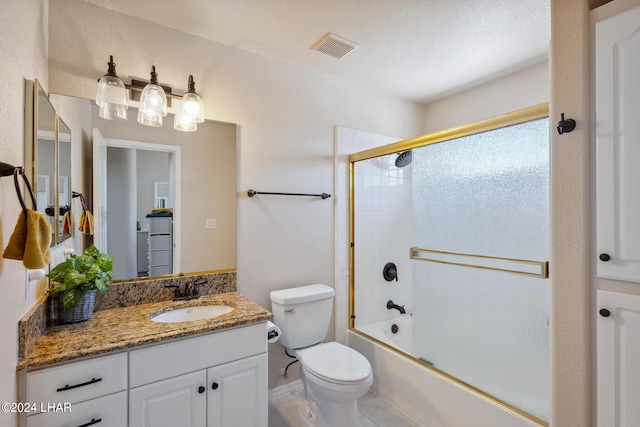 full bathroom featuring toilet, bath / shower combo with glass door, vanity, and visible vents