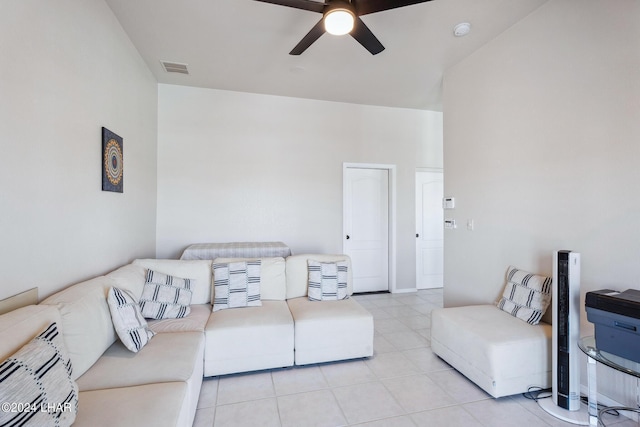 living area with visible vents, ceiling fan, and light tile patterned floors