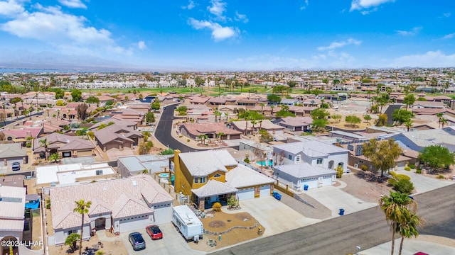 drone / aerial view featuring a residential view and a mountain view