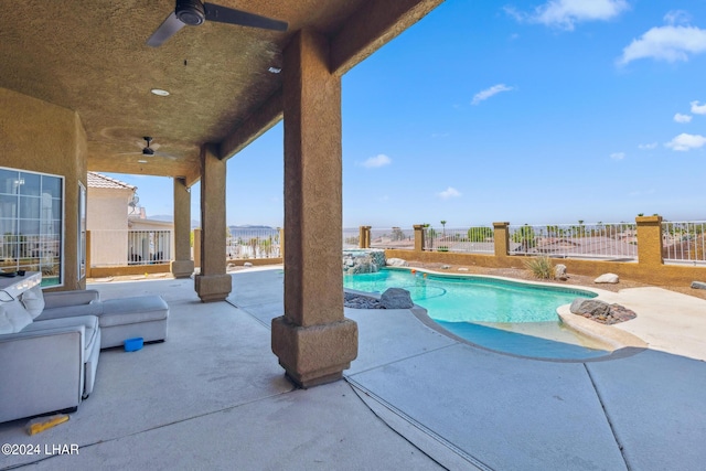 pool featuring ceiling fan, a fenced backyard, and a patio