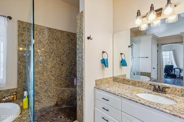 full bathroom featuring a tub to relax in, vanity, and a walk in shower