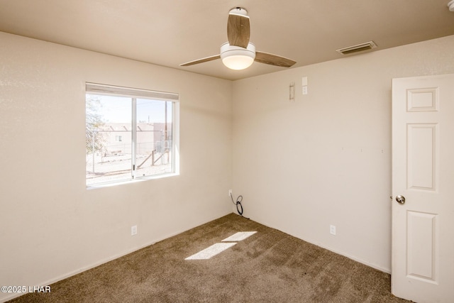 unfurnished room featuring ceiling fan, carpet flooring, and visible vents