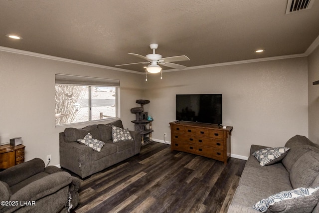 living area with dark wood-style floors, visible vents, and crown molding