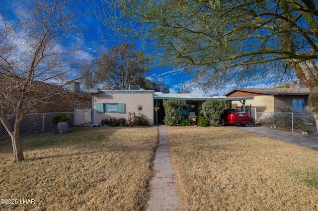 ranch-style home with a front lawn and a carport