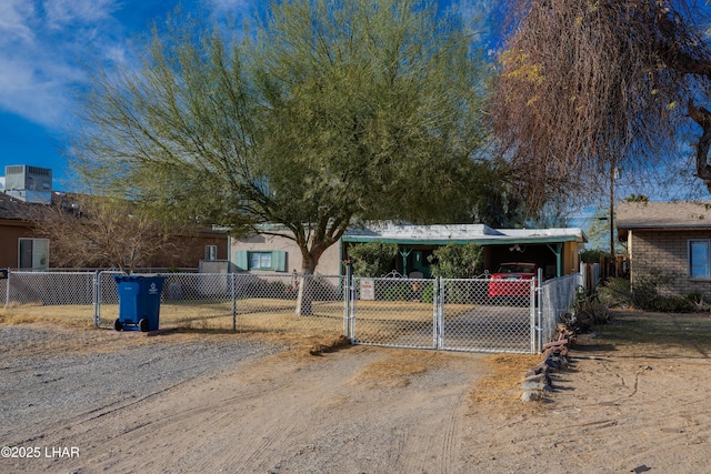 view of front of property featuring a carport and central air condition unit