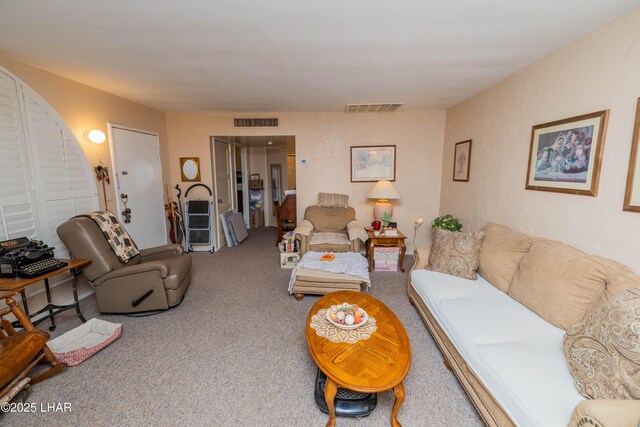 living area with carpet and visible vents