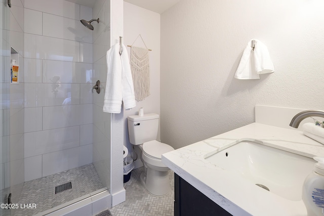 1636 Mcculloch Blvd S, Lake Havasu City, AZ 86406 - bathroom with vanity, a tile shower, toilet, and tile patterned flooring