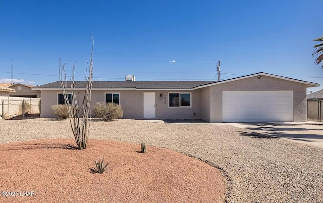 1636 Mcculloch Blvd S, Lake Havasu City, AZ 86406 - ranch-style house with driveway, an attached garage, and stucco siding