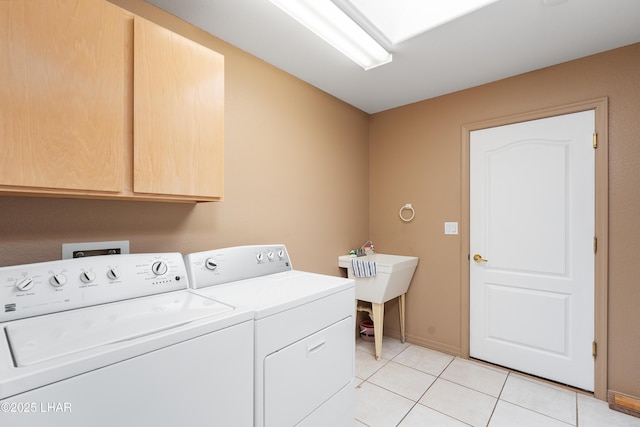 1607 Linda Dr, Lake Havasu City, AZ 86403 - washroom with cabinet space, independent washer and dryer, light tile patterned flooring, and baseboards
