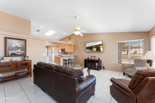 1607 Linda Dr, Lake Havasu City, AZ 86403 - living area with lofted ceiling, light tile patterned flooring, and a ceiling fan