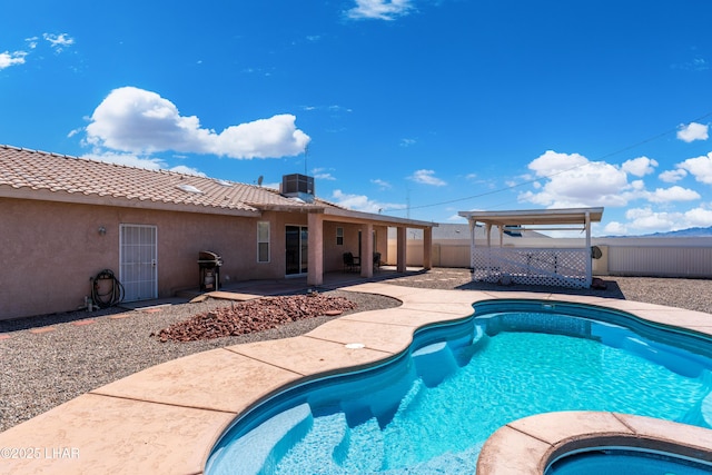 1607 Linda Dr, Lake Havasu City, AZ 86403 - view of swimming pool with a fenced backyard, a patio area, area for grilling, central AC unit, and a pool with connected hot tub
