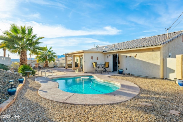 view of pool featuring a patio, fence, and a fenced in pool