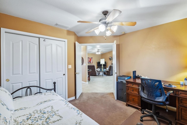 bedroom featuring light carpet, visible vents, baseboards, a ceiling fan, and a closet