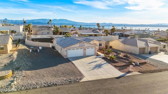 bird's eye view featuring a residential view and a mountain view