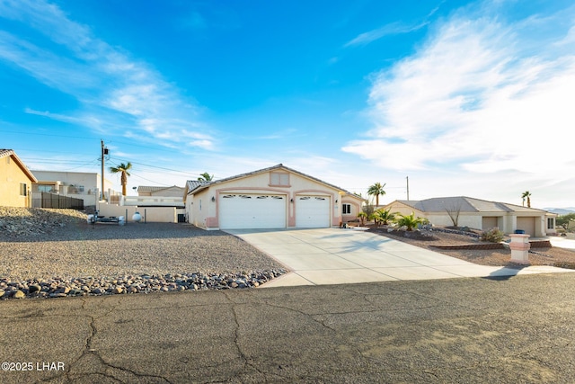 single story home featuring driveway and an attached garage