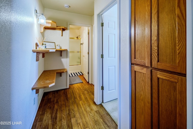 corridor with wood-type flooring
