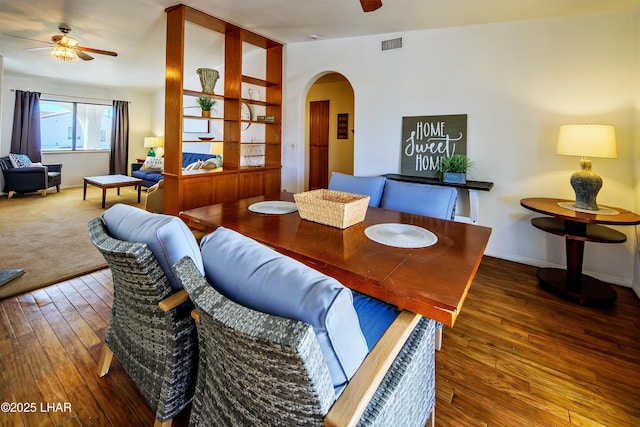 dining room featuring wood-type flooring, lofted ceiling, and ceiling fan