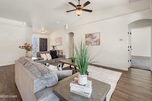 living room featuring vaulted ceiling, ceiling fan, and dark hardwood / wood-style flooring