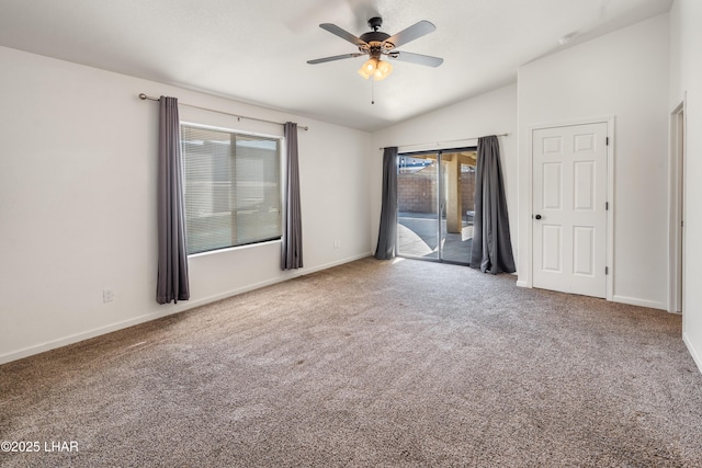 unfurnished room with lofted ceiling, carpet floors, and ceiling fan