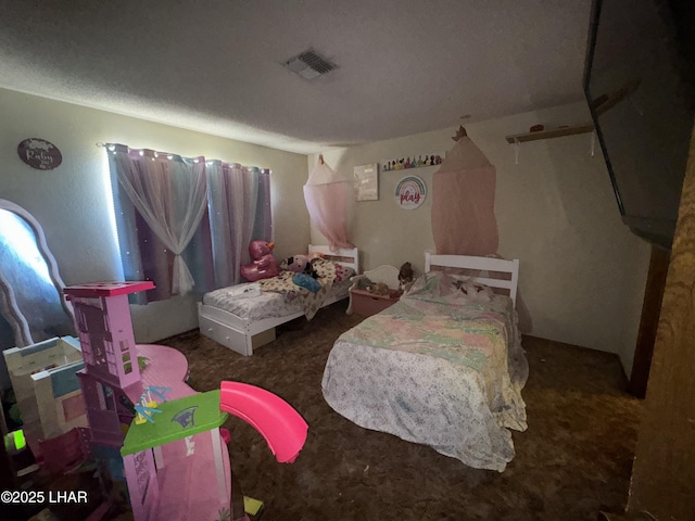 bedroom featuring carpet floors and visible vents