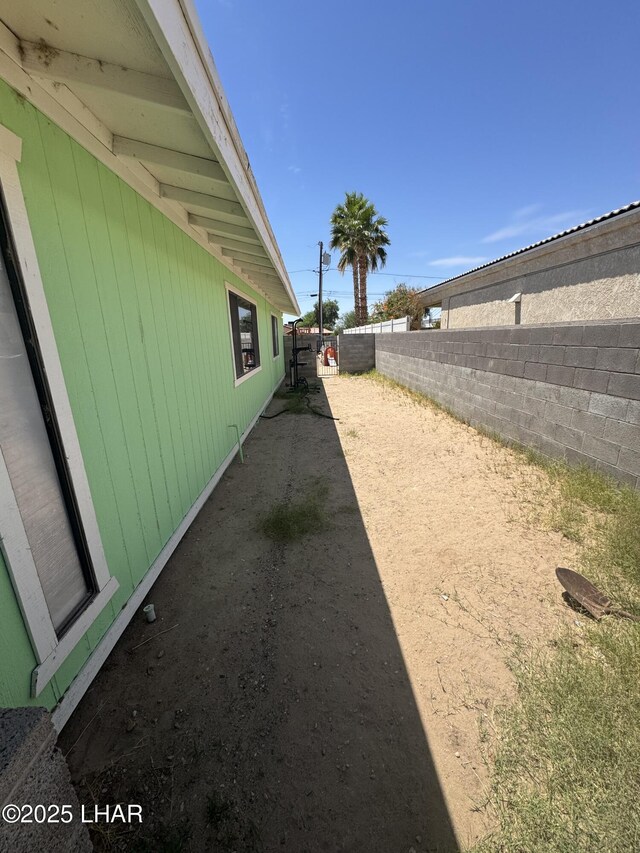 view of property exterior with a fenced backyard