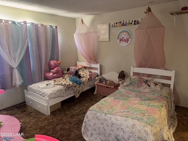 bedroom featuring carpet floors and a textured ceiling
