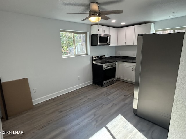 256 Lake Havasu Ave S Unit B75, Lake Havasu City, AZ 86403 - kitchen featuring white cabinetry, appliances with stainless steel finishes, hardwood / wood-style floors, and ceiling fan