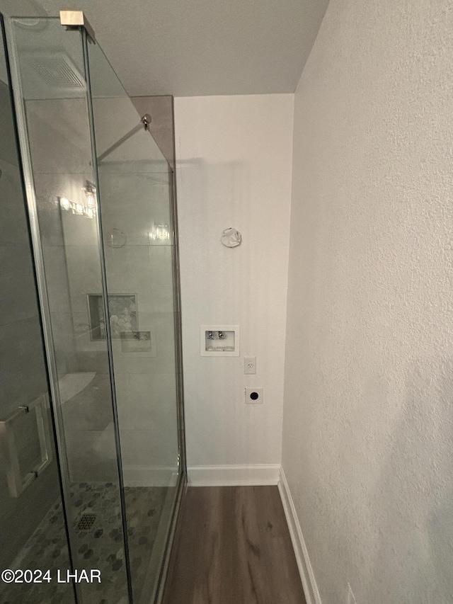256 Lake Havasu Ave S Unit B75, Lake Havasu City, AZ 86403 - bathroom with a shower with shower door and hardwood / wood-style floors