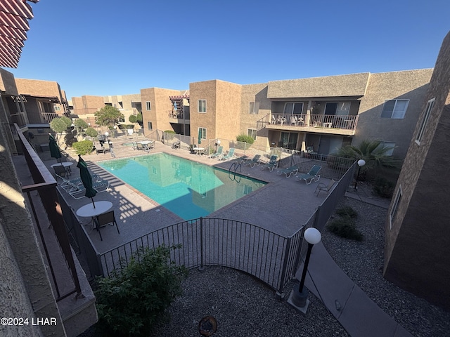 view of swimming pool with a patio area