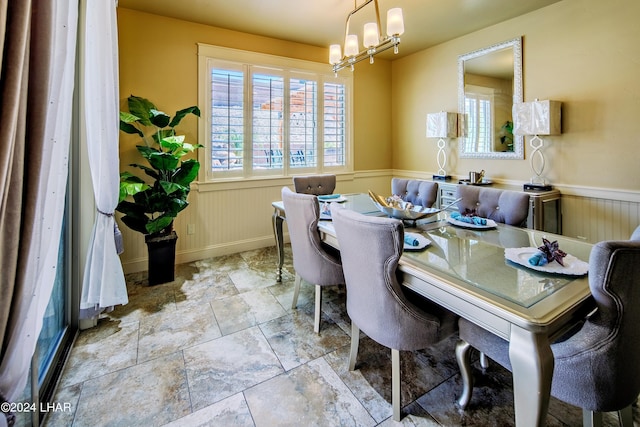 dining area with an inviting chandelier