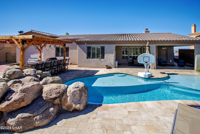 view of pool featuring a patio area