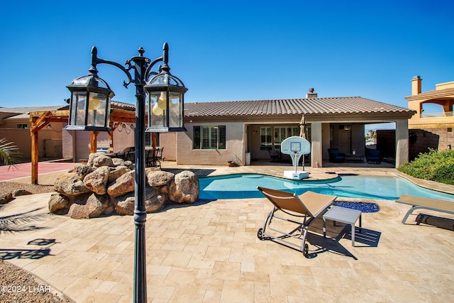 view of swimming pool with a patio area