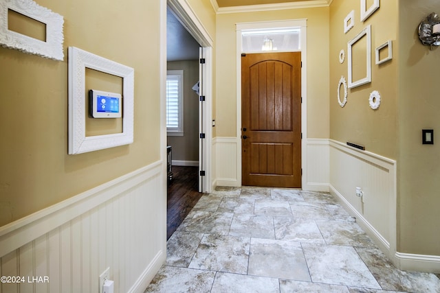 entryway with crown molding