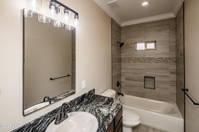 bathroom with visible vents, crown molding, shower / washtub combination, toilet, and vanity