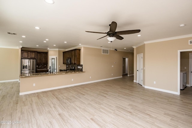 unfurnished living room with recessed lighting, visible vents, light wood-style flooring, and baseboards