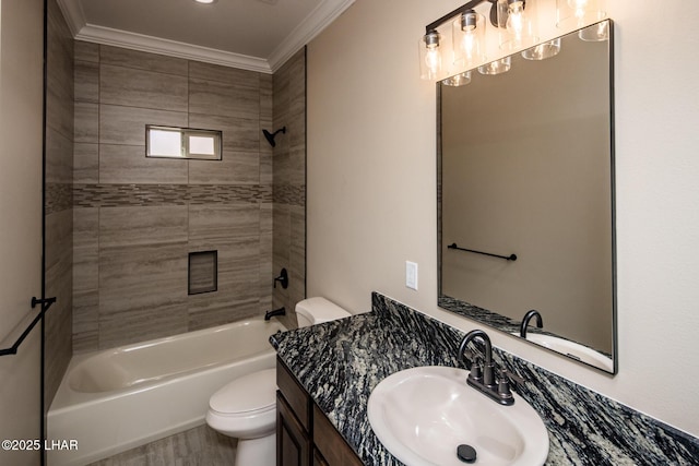 full bathroom featuring vanity, bathing tub / shower combination, toilet, and ornamental molding