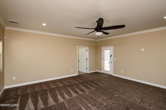 spare room with visible vents, crown molding, and baseboards