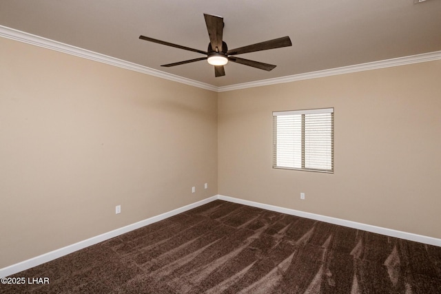 empty room featuring baseboards, dark carpet, a ceiling fan, and crown molding