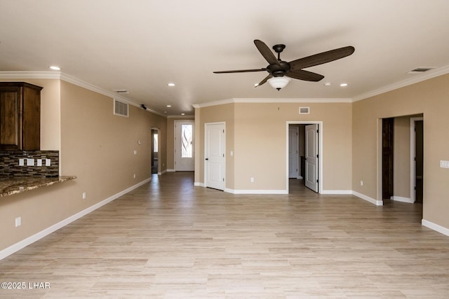 unfurnished living room with a ceiling fan, baseboards, visible vents, and light wood-type flooring